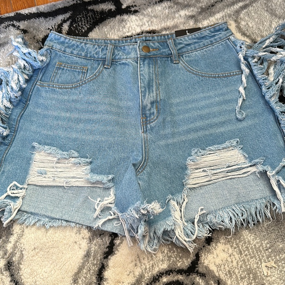 Fashion Nova jean shorts with fringed sides